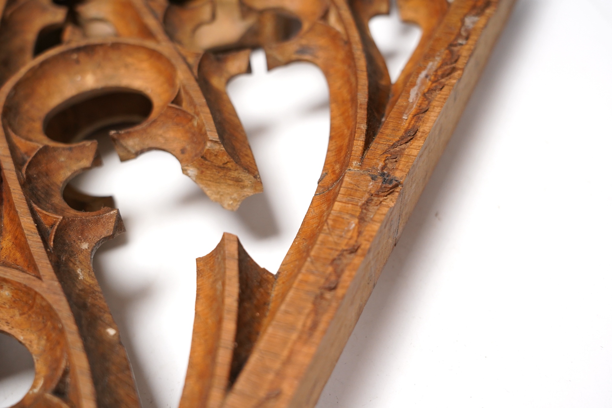 A set of three Victorian or earlier gothic carved oak tracery panels, 37cm high. Condition - fair to poor, losses and cracking